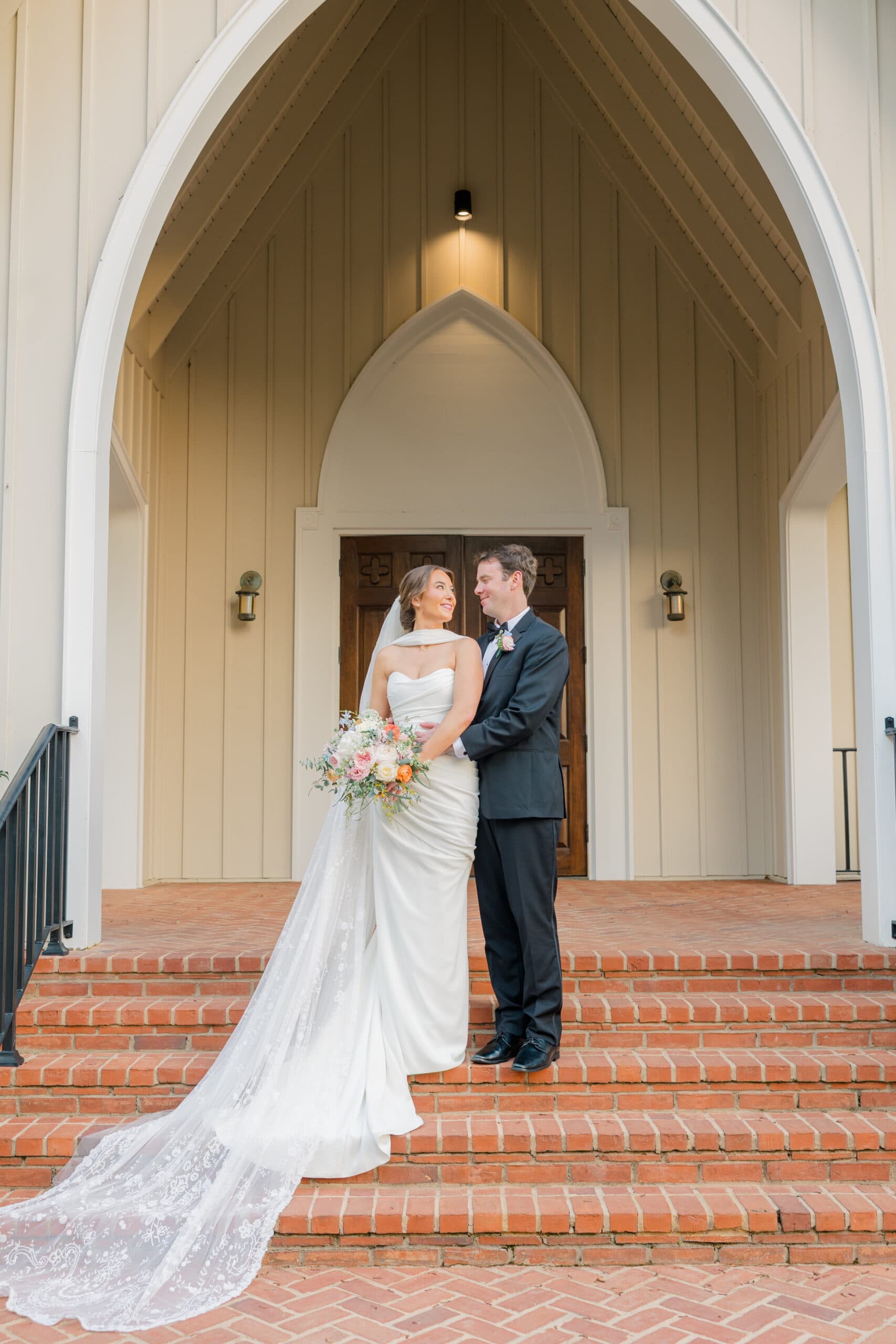 Bride and groom on the chapel steps