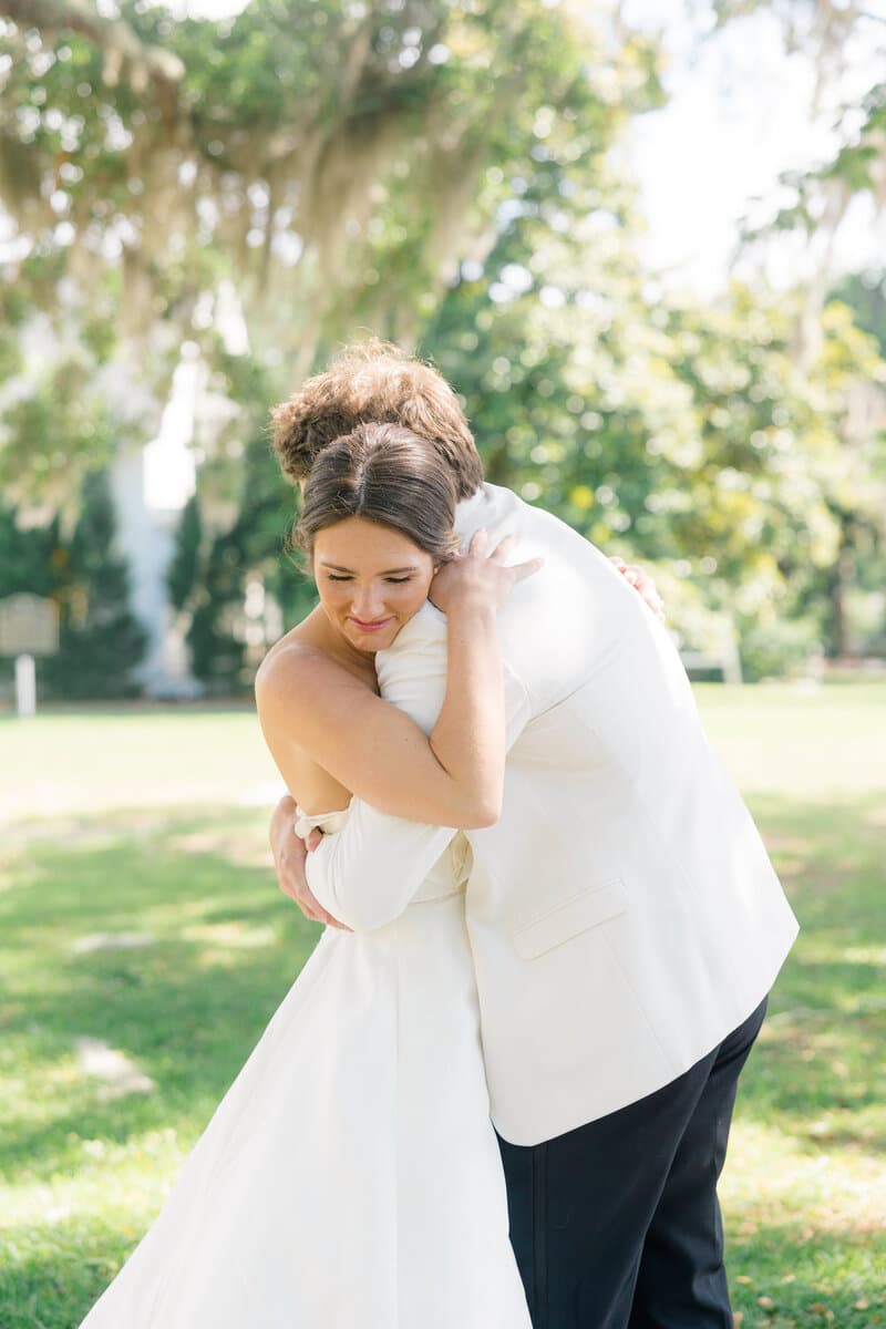 A newlywed couple embracing after their ceremony