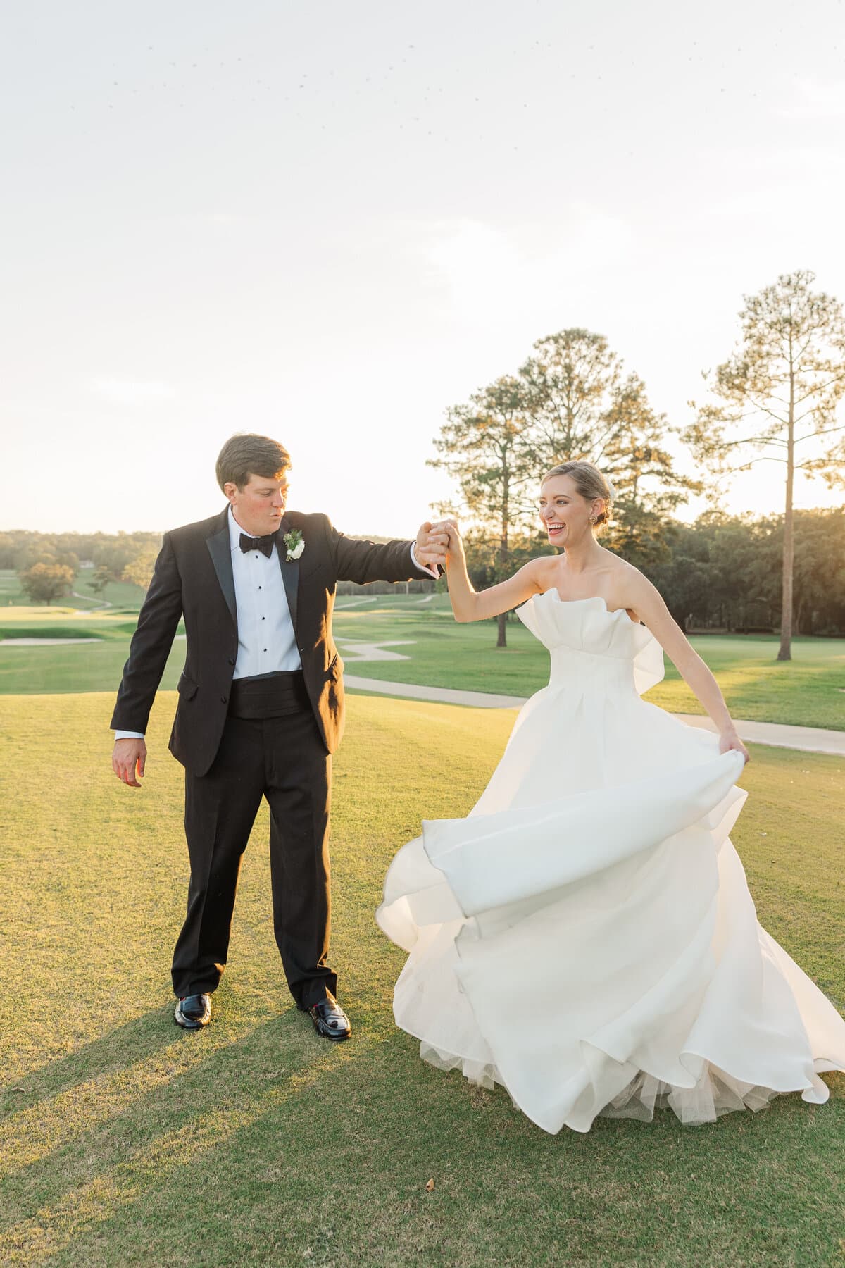 Bride and groom dancing in the evening light