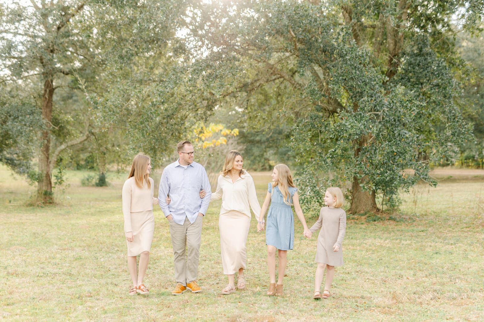 Jennie Tewell walking with her husband and daughters