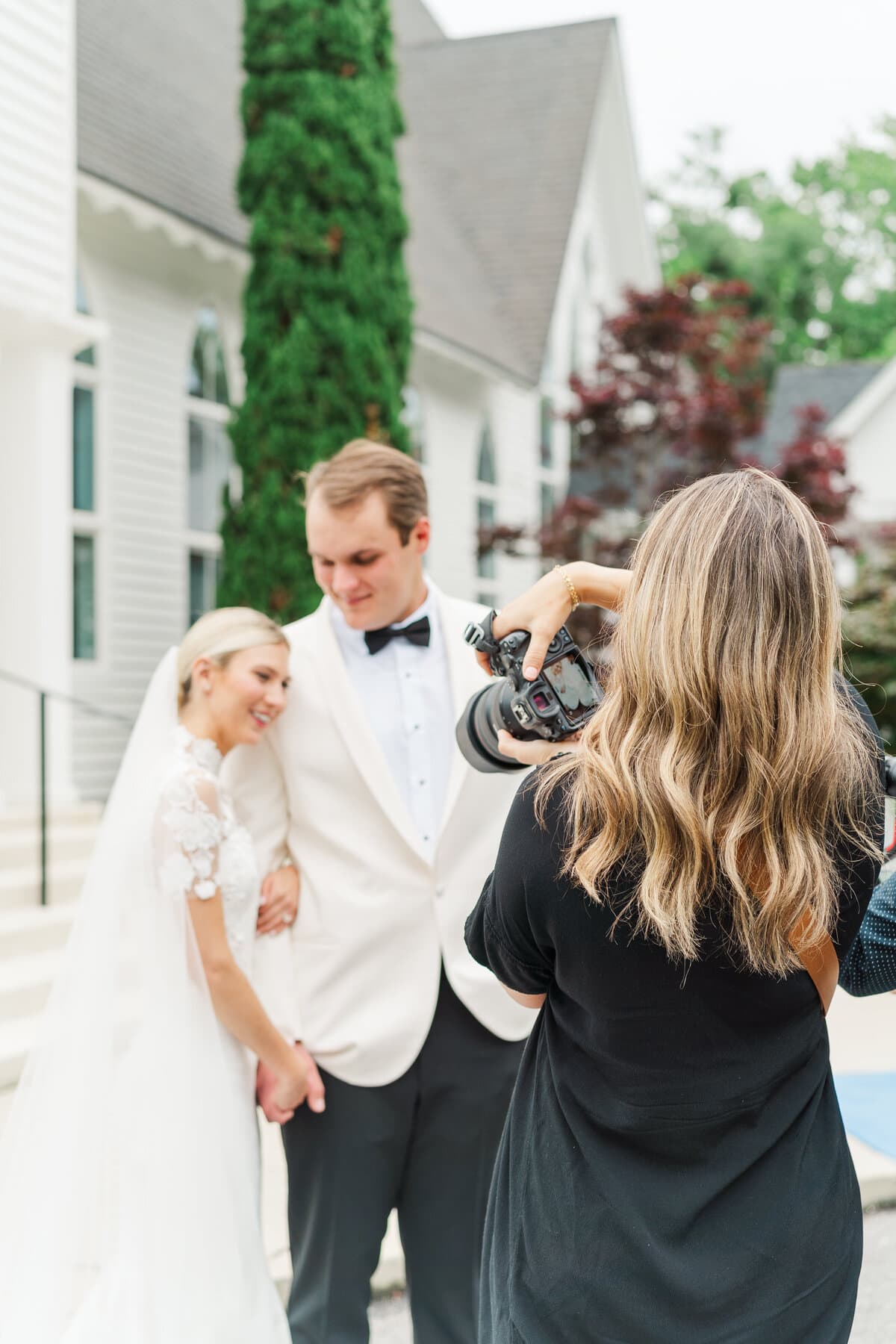 Jennie photographing a bride and groom