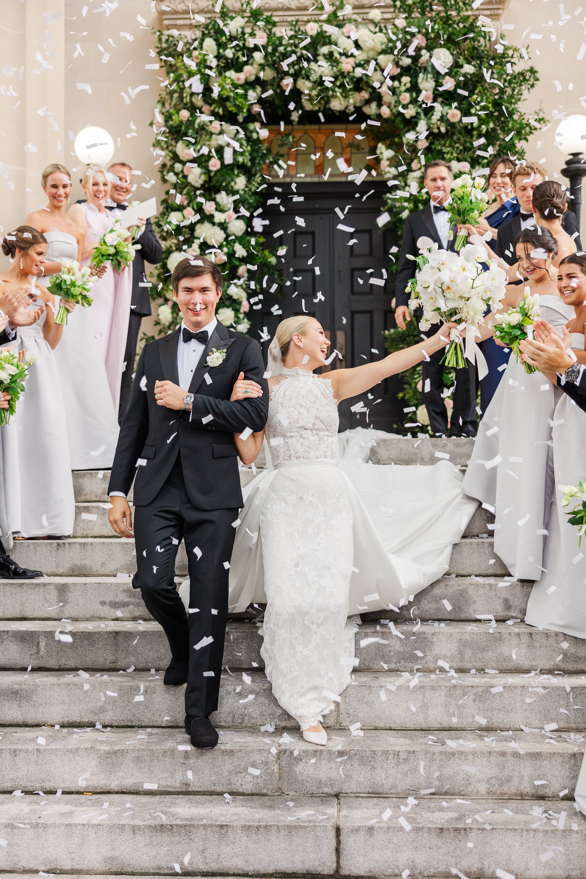 Grace and J celebrating with their wedding party