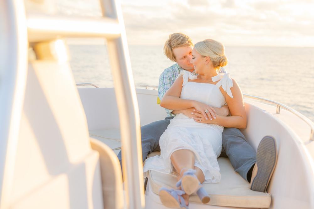 Romantic couple Audrey and Lyon, bathed in soft sunlight, share a loving moment beneath the mossy oak trees at the picturesque Grand Hotel in Fairhope.
