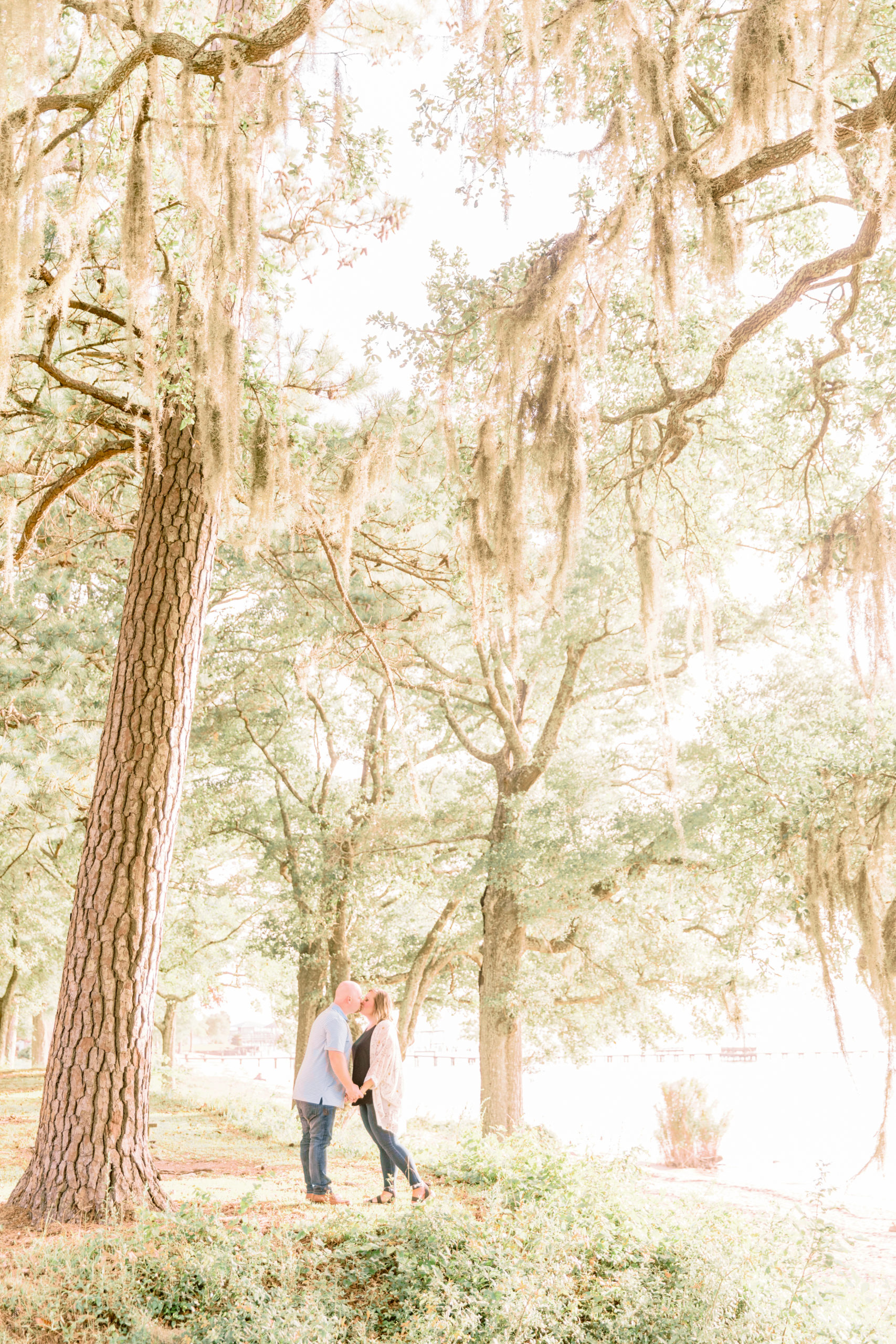 engagement photo under the mossy oak trees in fairhope alabama