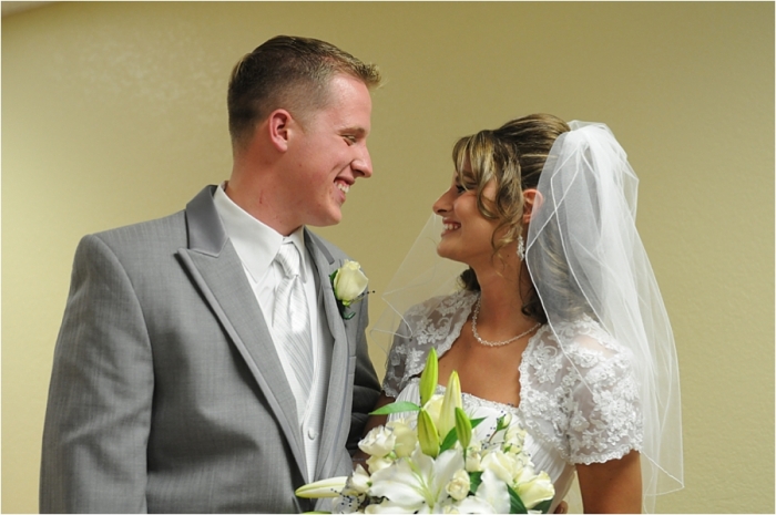 Jennie and Andrew smiling at each other on their wedding day